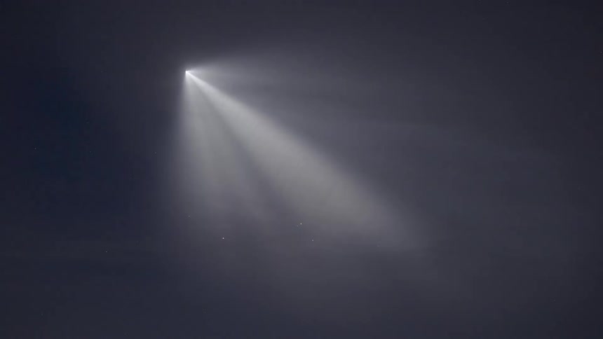 A rocket creates a space jellyfish across the sky when the exhaust plumes catch the sun's rays creating a brightly illuminated, bulbous cloud with wispy trails