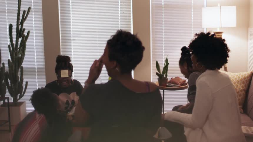 Women cheer and play a game together