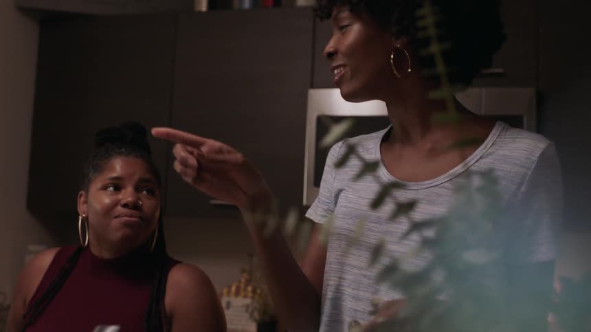The women laugh, eat and talk together