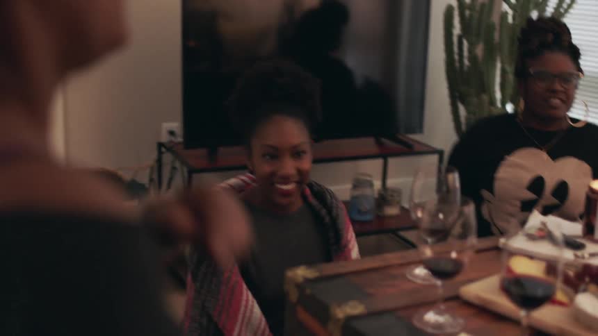 Women laugh and talk together