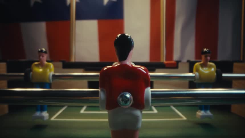American flag inspired hanging hangs near a foosball table