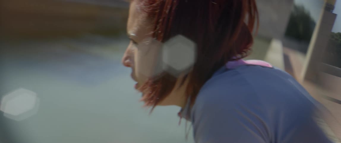 A hunched over woman breathes heavily