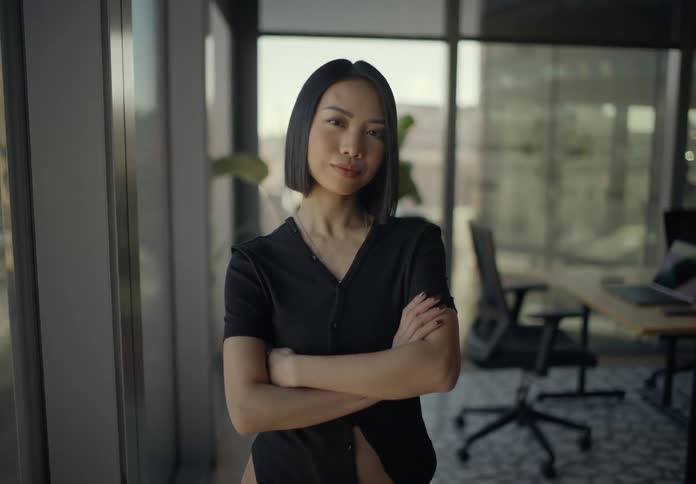 Woman crossing her arms in an office room