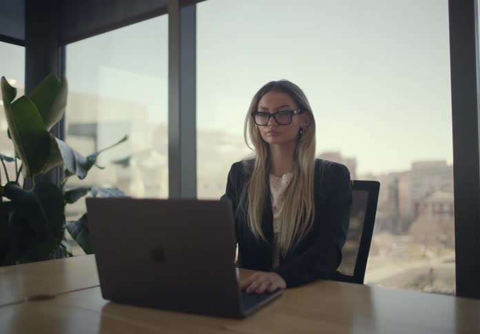 A woman sitting around using a laptop