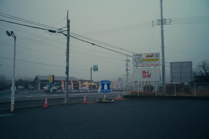An area of town with buildings and signs