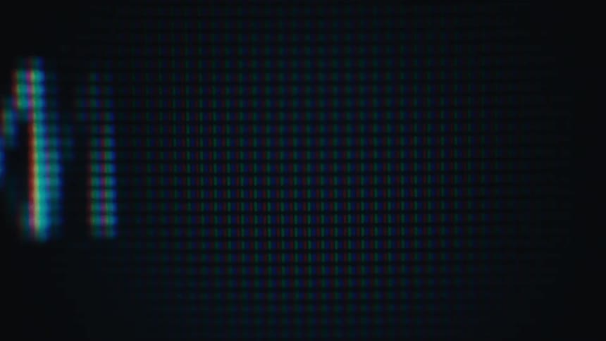 Fragments of the word updated appearing in a digital pixelated font that resembles a closeup of a crt or led monitor a digital timestamp specifically showing 202 followed by seconds and the pm designation flickering across the screen with a g