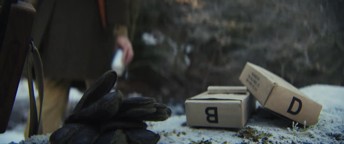 The man grabs his canteen to fill it