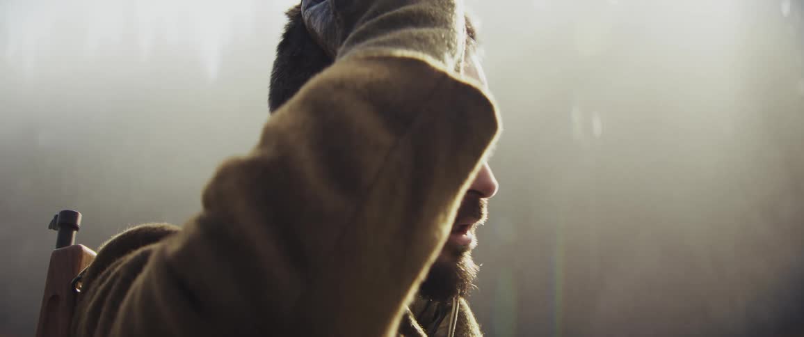 Soldier in a foggy forest during the day