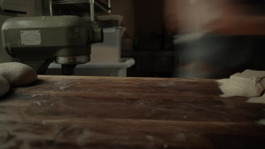 A person mixing dough