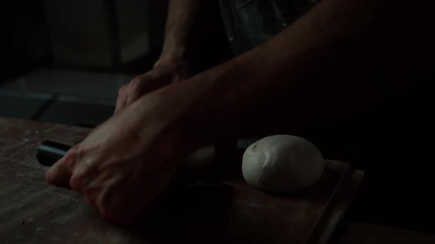 The chef forms small balls of dough