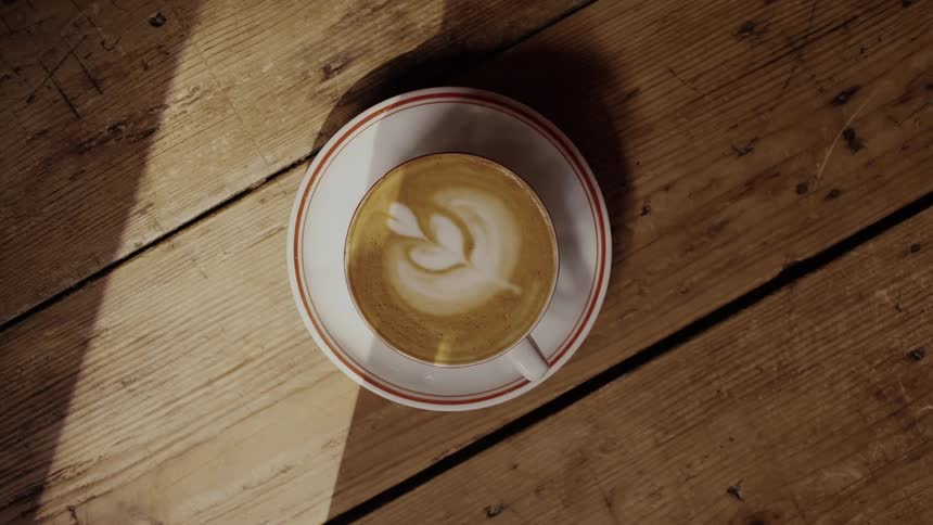 A cup of cappuccino is served