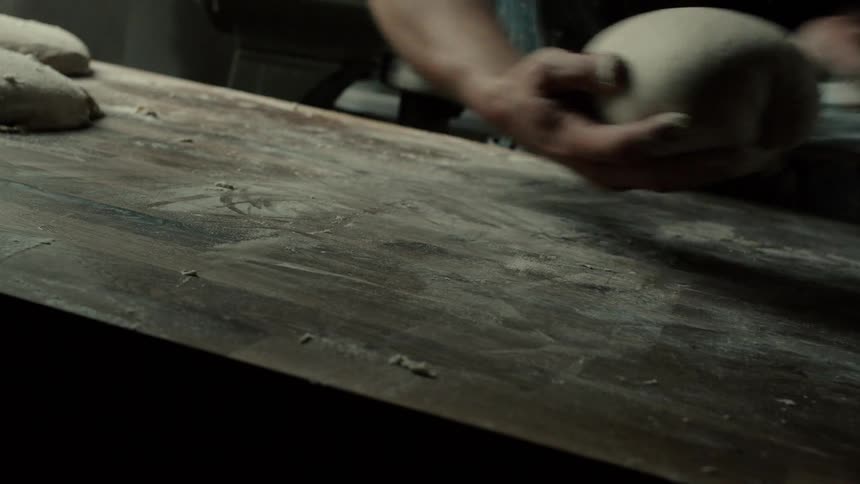 A man mixing some dough