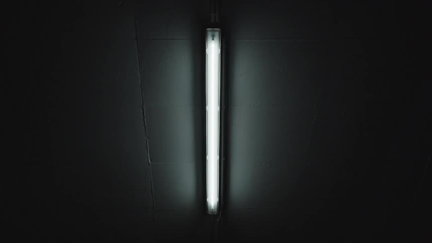 A single light is in the dark room