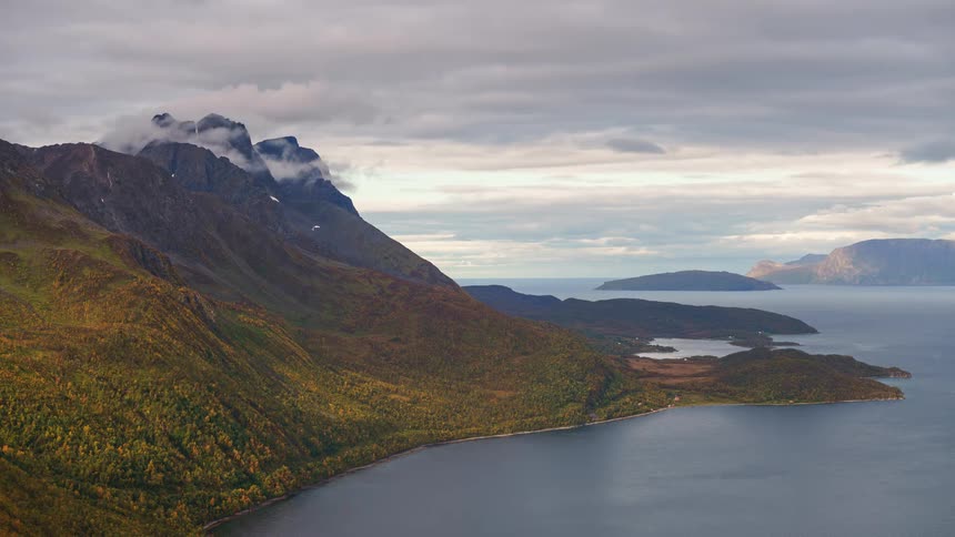 An aerial view of a coast with hills