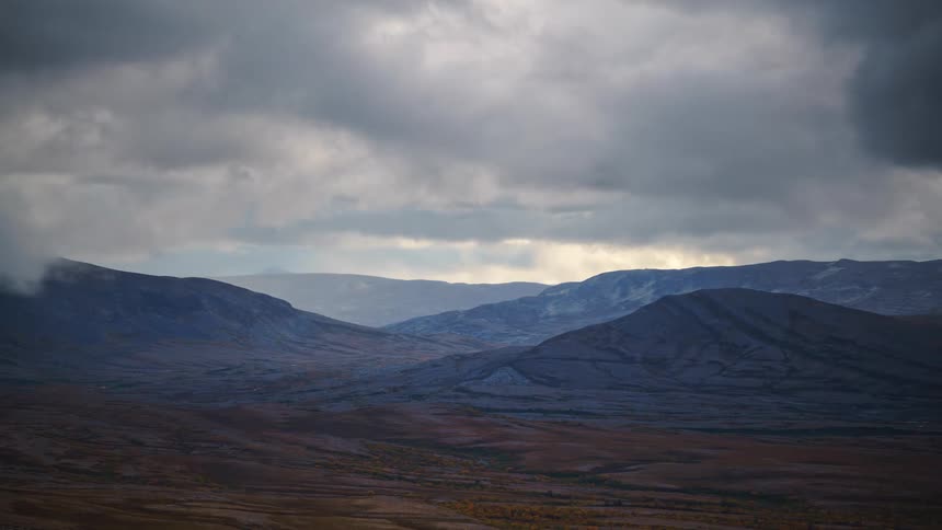 Mountain landscape against a hazy sky