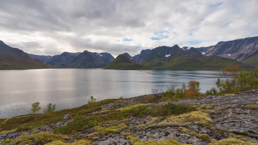 A lake that is at the base of some mountains