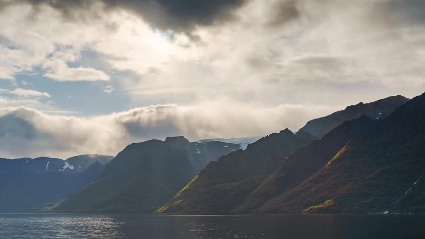 A view of a landscape with hills along the coast