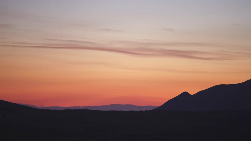 A view of a landscape with sun setting