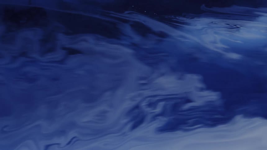 A moody abstract expanse of deep and pale blue tones flows across the frame like ink or mist drifting through water forming soft swirling patterns