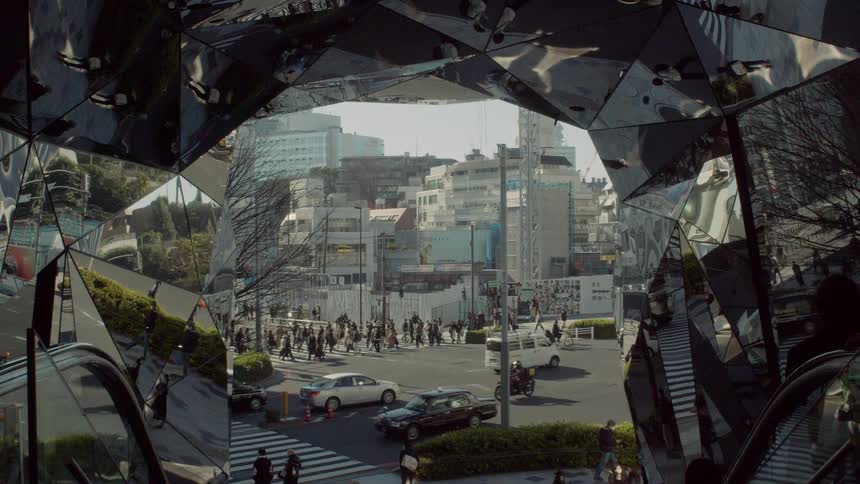 The monument in the city is covered with a mirrored surface