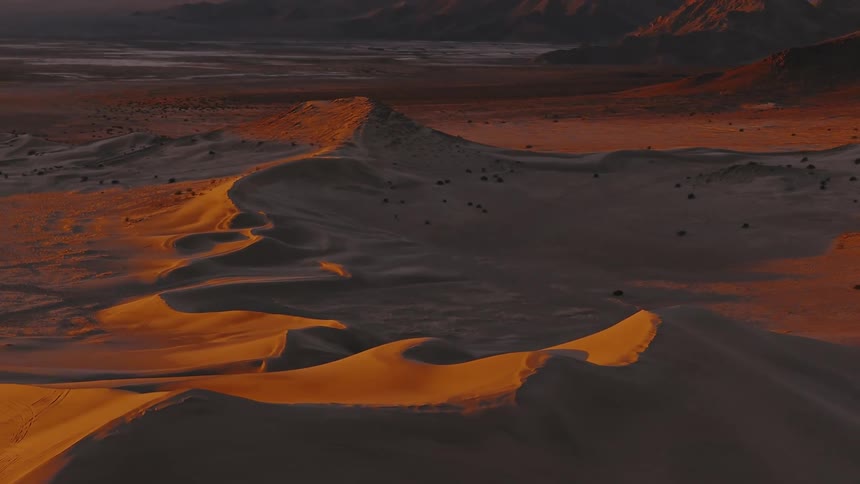 An aerial view of sand dunes in the desert