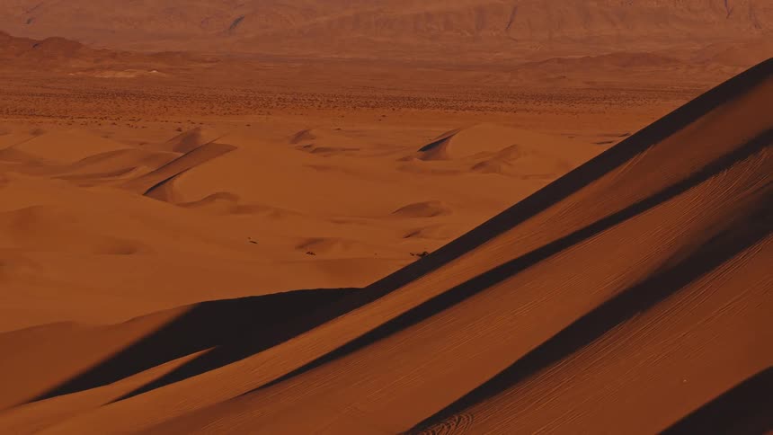 An aerial view of sand dunes in the desert