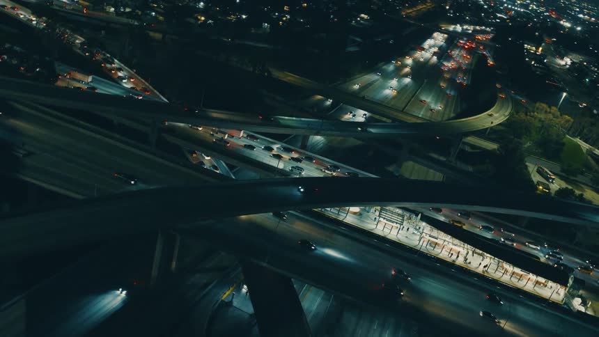 An aerial view of cars driving on a highway