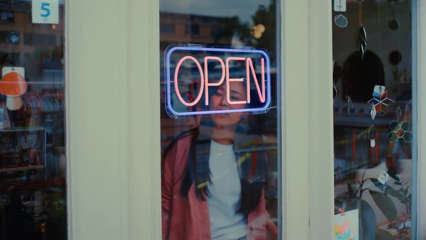 A woman entrepreneur opens her shop to the communit