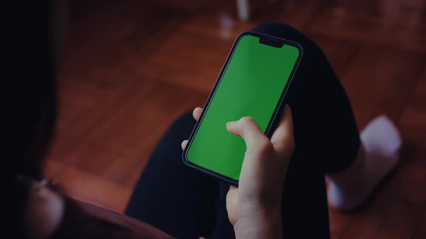 A person takes out their phone