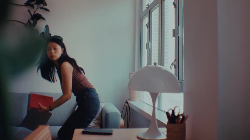 A woman leaving out of a room