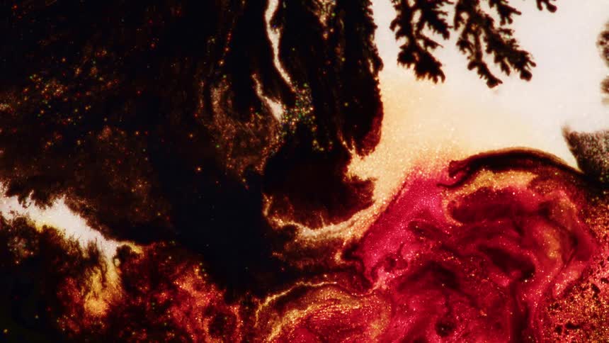 Some red white and black fluids swirling