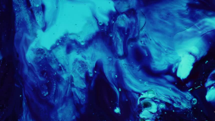 Sweeping curves of light cyan ink surge downward from the top of the frame creating organic paths as they push through the denser dark navy liquid