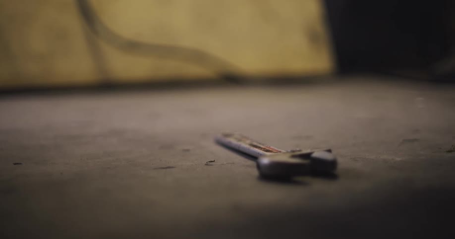 Mechanical tool falling to the ground someone catching it