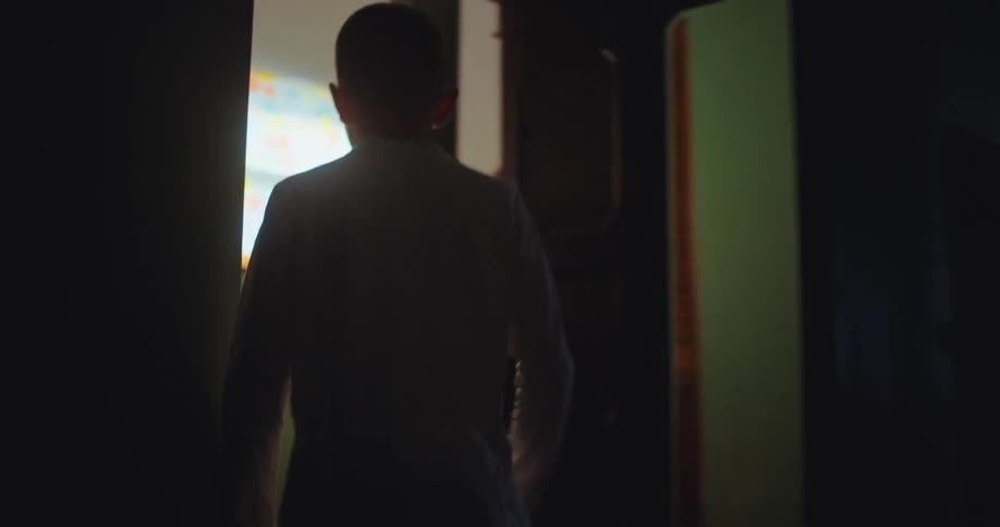 A kid running up stairs in a house