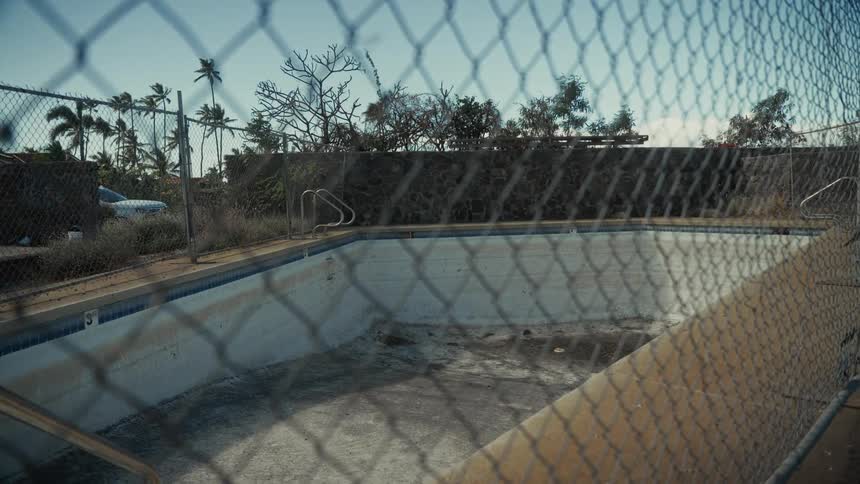 A view of a pool in a suburban area