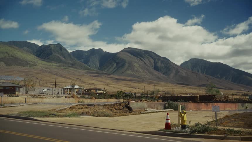 A construction worker in a neighborhood
