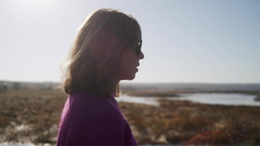 Woman wearing sunglasses enjoying the natural scenery