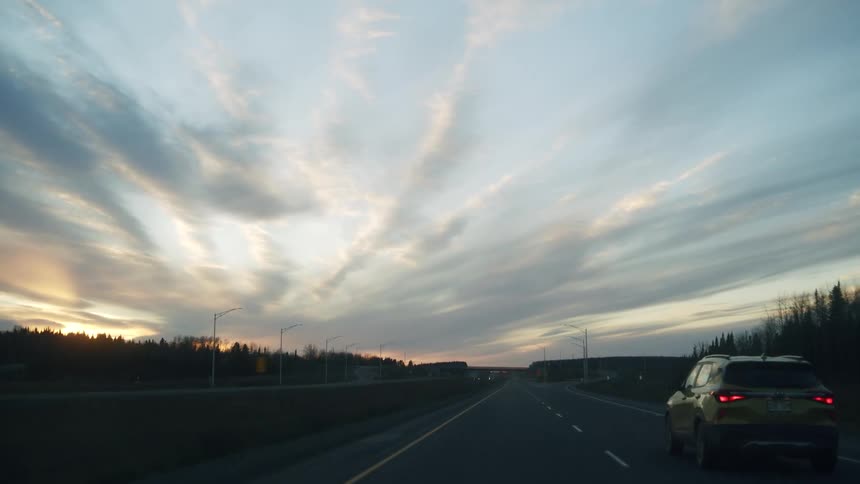 Cars and trucks travel on the highway