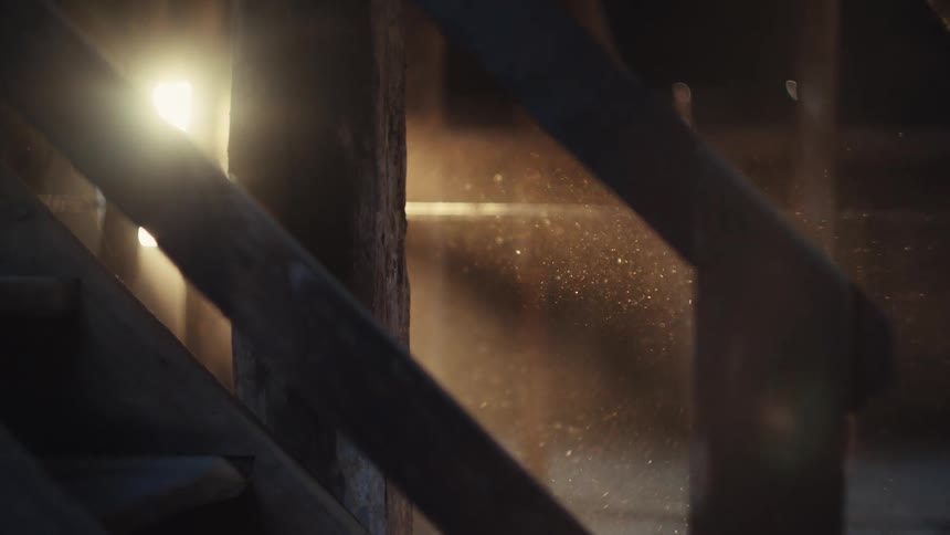 Dust floats in the barn under the sunlight