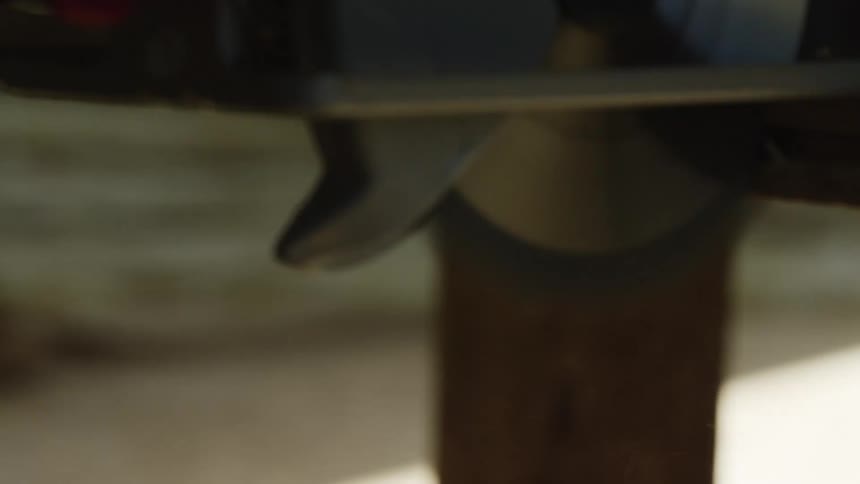 Circular saw in motion indoors during day time
