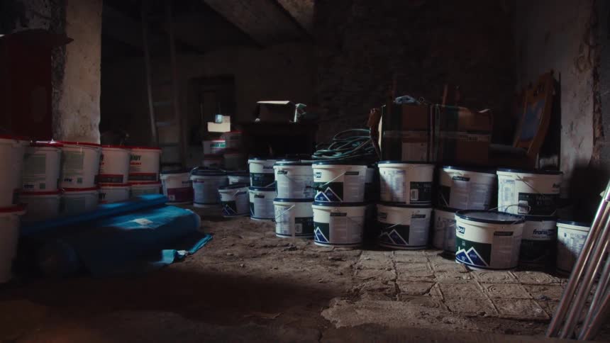 Construction supplies in buckets in an interior space of a construction site
