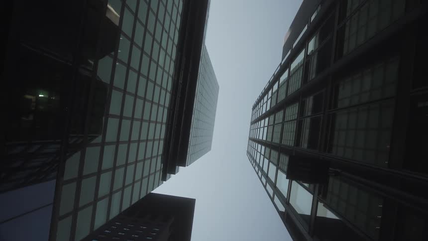 Looking up at tall modern towers and skyscrapers