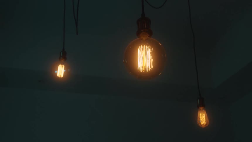 The old lightbulbs shine in the dark room