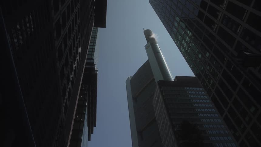 Looking up at tall modern towers and skyscrapers