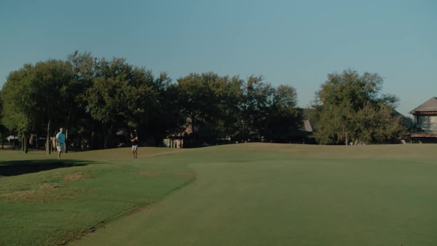 The golf ball bounces on the green