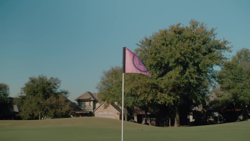 Pink flag positioned on a golf course