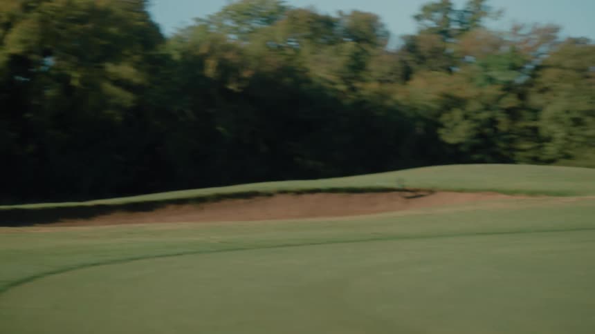A large golf course with a sand trap