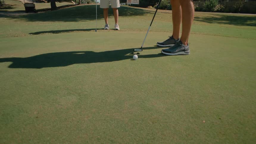 Golfer takes a light shot and misses the target