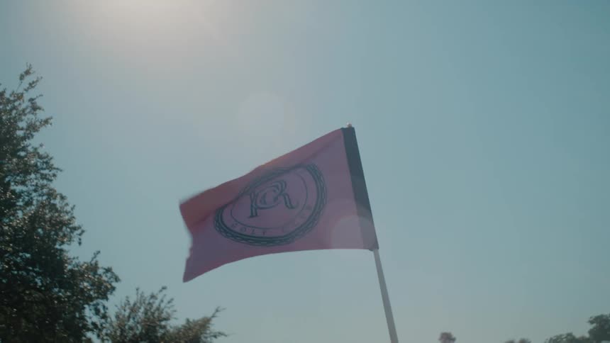 Wind blows the flag on the golf course
