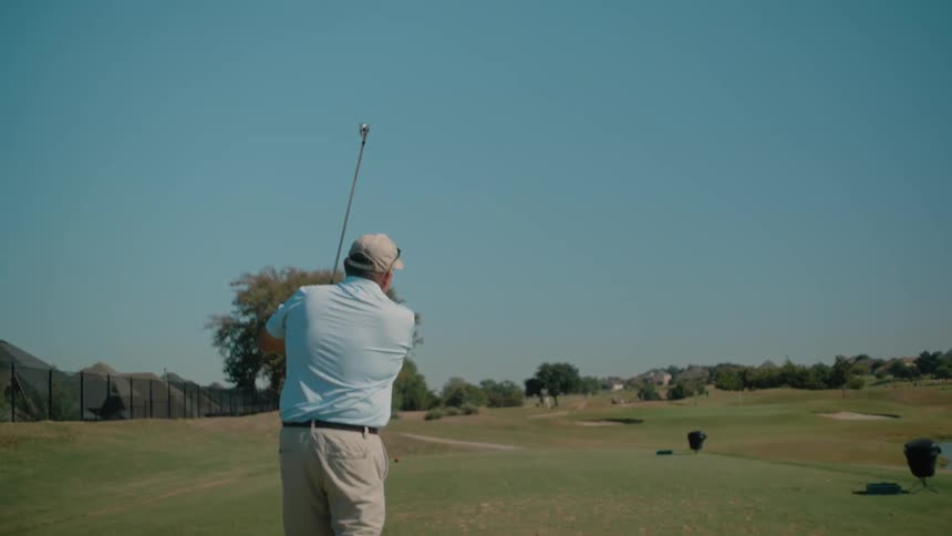 A man playing golf